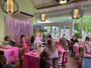 Barbie entertainer hosting a party in a garden centre