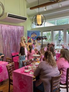 Barbie entertainer hosting a party in a garden centre