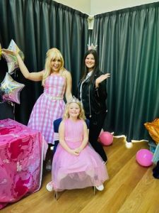 family pictured with a barbie entertainer