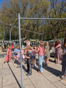 Children having fun at Garden King with a Taylor Swift inspired entertainer