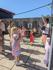 Taylor Swift entertainer using a bubble machine at Garden King
