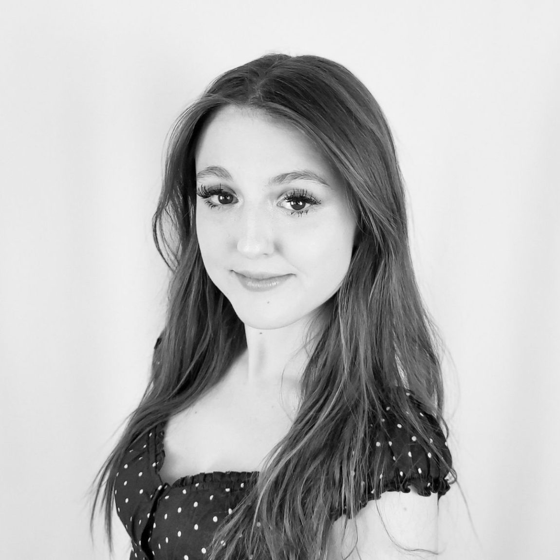 black and white headshot of Emily